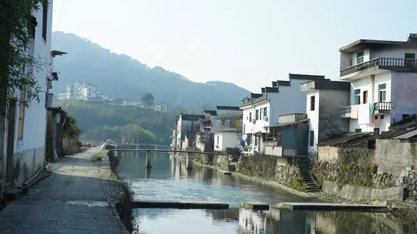 stock image One old traditional Chinese village view with the old arched stone bridge and old wooden buildings in the Southern countryside of the China