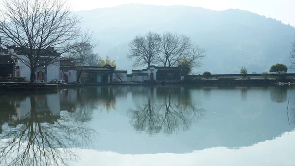 stock image One old traditional Chinese village view with the old arched stone bridge and old wooden buildings in the Southern countryside of the China