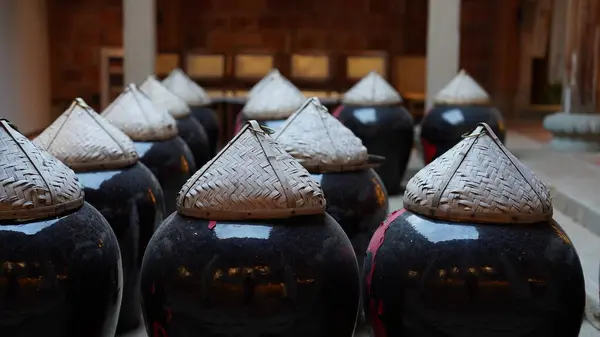 The traditional making rice wine ways with the ceremics jar in China