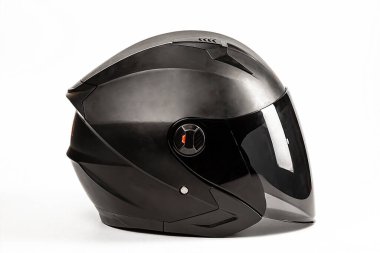 Black helmet of a motorcyclist with a visor on a white background. Moto accessories. clipart