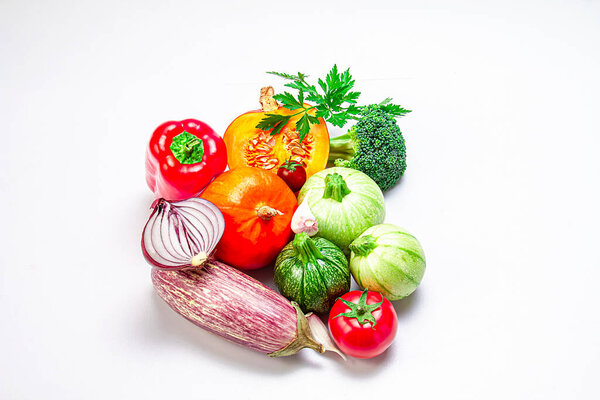 Fresh organic vegetables on a white background. Photo top view. The concept of a balanced diet. Food photo.