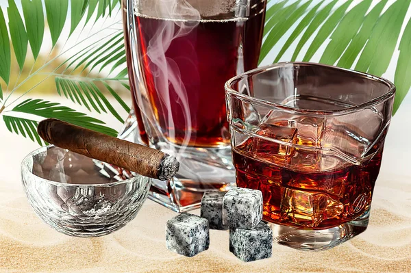 A glass of Scotch whiskey with ice and a cigar on a background of nature close-up. Food photo.