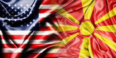 ABD ve Makedonya 'nın ulusal bayrakları tek bir bayrakla birleştiriliyor ve yan yana çırpınan bir pamuk zemin üzerine konuyor.