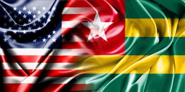 Birleşik Devletler ve Togo 'nun ulusal bayrakları bir araya getirilip yan yana çırpınan bir pamuk arkaplanda yerleştirilmiştir..