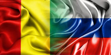 Rusya ve Gine 'nin ulusal bayrakları bir araya getirilip yan yana çırpınan bir pamuk arkaplanda yerleştirilmiştir..