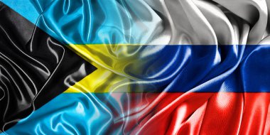 Rusya ve Bahamalar 'ın ulusal bayrakları bir araya getirilip yan yana çırpınan pamuklara konur..