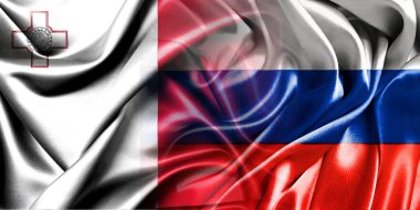 Rusya ve Malta 'nın ulusal bayrakları bir araya getirilip yan yana çırpınan bir pamuk arkaplanda yerleştirilmiştir..