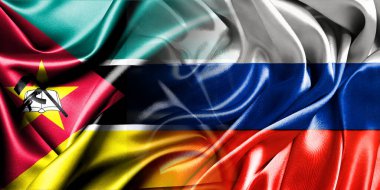 Rusya ve Mozambik 'in ulusal bayrakları birleştirilip yan yana çırpınan bir pamuk zemin üzerine konuyor..