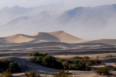 Death Valley, California. Mesquite Flat sand dunes. Sandstorm on the dunes. 