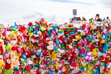 Editorial image of colorful love locks attached to a fence at N Seoul Tower in Seoul, South Korea. The vibrant padlocks symbolize love and commitment, creating a popular attraction for visitors