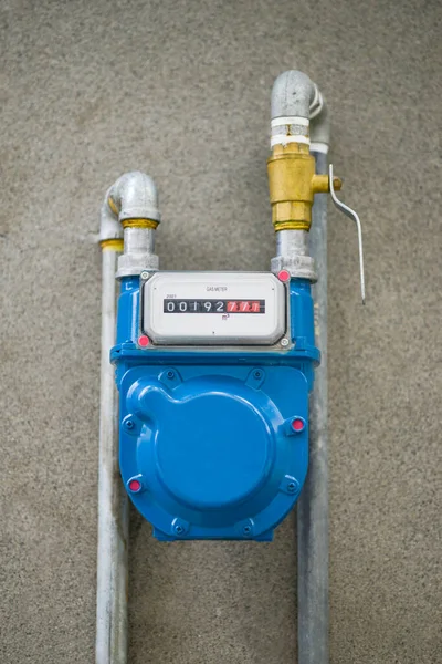Residential natural gas meter measuring gas consumption.