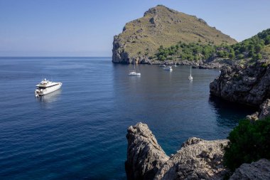 Recreational boats stranded in the cove, Sa Calobra, Escorca, Natural landscape of the Serra de Tramuntana, Mallorca, balearic islands, Spain