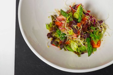 Vegetable salad on a white plate, mallorca.