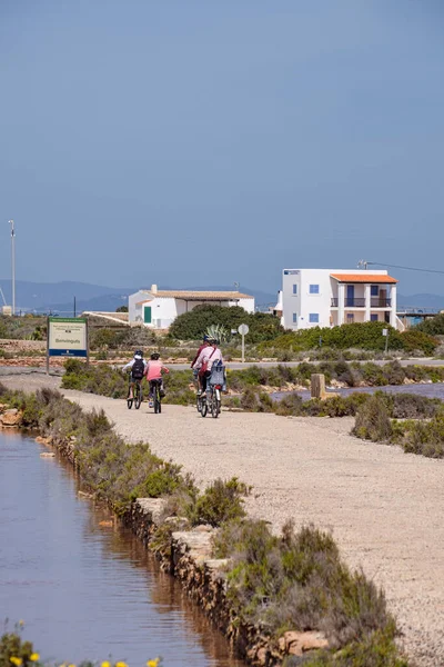 stock image family bike ride, La Savina, Formentera, Pitiusas Islands, Balearic Community, Spain