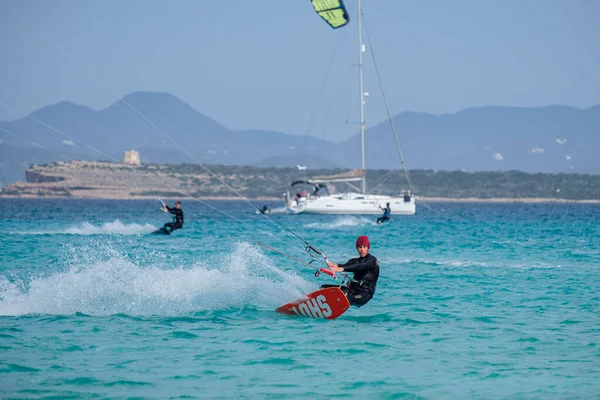 stock image kitesurfing on Illete beachFormentera, Pitiusas Islands, Balearic Community, Spain