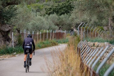 cyclist on the road, Mancor de la Vall, Mallorca, Balearic Islands, Spain