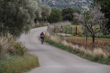 cyclist on the road, Mancor de la Vall, Mallorca, Balearic Islands, Spain