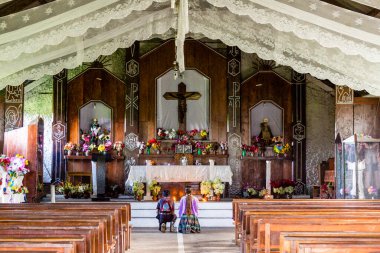 marriage praying in church, Lancetillo, La Parroquia, zona Reyna, Quiche, Guatemala, Central America clipart