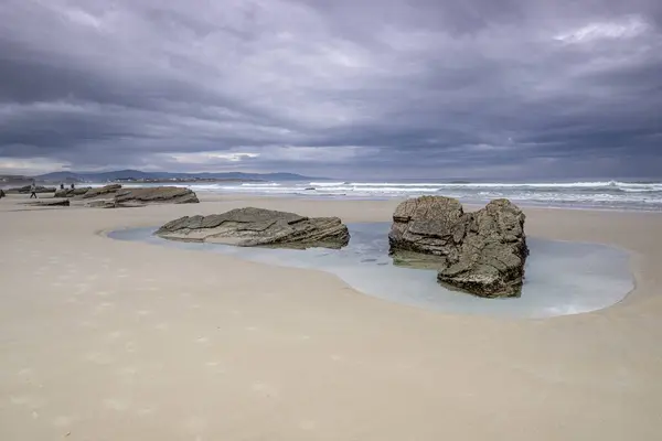 stock image Las Catedrales beach, low tide between the reefs, Ribadeo, Lugo, Galicia, Spain