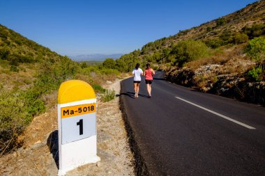 trekkers on road from Randa to Cura,  massif de Randa, Algaida, Mallorca, balearic islands, spain, europe clipart