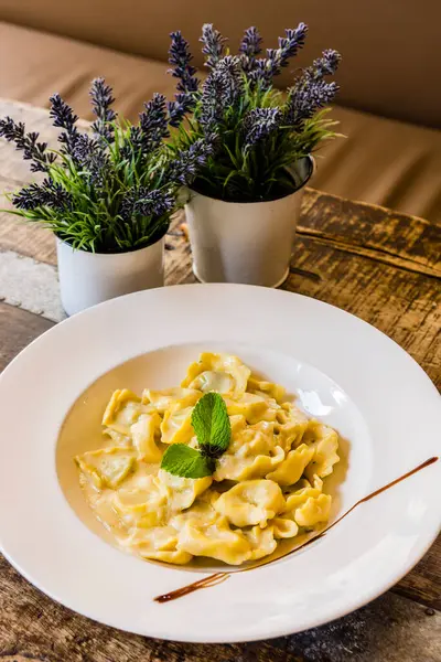 stock image Vegetable tortellini with cheese sauce, restaurant S'Escrivania, Porreres, Mallorca, Balearic Islands, Spain, Europe