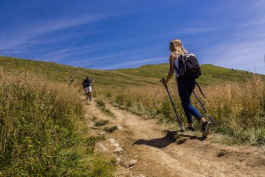 Hikers on the Carynska Polonina ridge, Bieszczady National Park, UNESCO Reserve - Eastern Carpathian Biosphere Reserve, Carpathian Mountains, Poland, Eastern Europe clipart