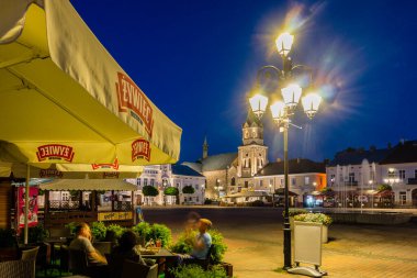 restaurant in front of the Franciscan church and monastery, neo-romanesque, market square, Sanok,  Subcarpathian Voivodeship, Poland,  eastern europe clipart