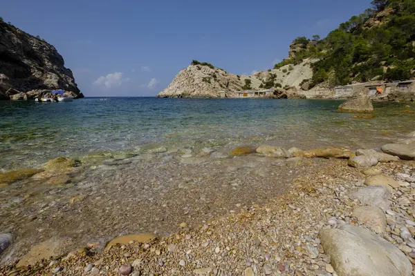 stock image Es Portitxol beach, stone cove, Municipality of Sant Joan de Labritja, Ibiza, Balearic Islands, Spain