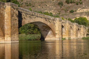 Medieval bridge over the river Ebro, San Vicente de la Sonsierra, La Rioja, Spain clipart