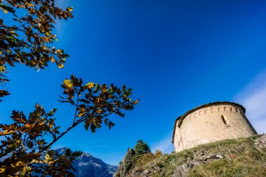 Chapel of Sant Miqueu (chapel of San Miguel), dated to the 10th century , early Romanesque, Vilamos, Aran valley, Catalonia, Pyrenees mountain range, Spain clipart