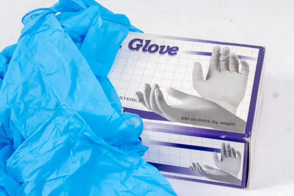 Blue gloves for health protection isolated on white background. Medical nitrile gloves. Manufacture of rubber gloves, latex gloves. protective gloves