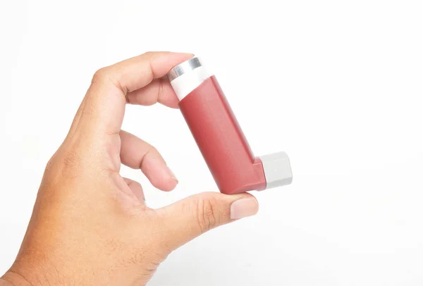 stock image A picture of hand holding inhaler on white background