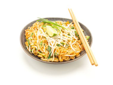 Pad Thai on a dish isolated on a white background. Thai style noodles. Top view. clipart