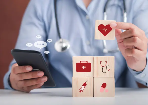 Hand Doctor Arranging Wood Blocks Healthcare Medical Icons Using Smartphone — Stock Photo, Image