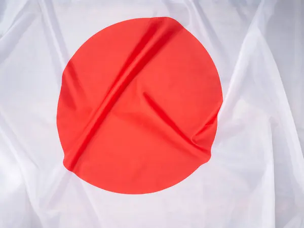Full frame of the Japanese flag. Top view. Flat lay. Close-up photo.