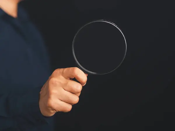 Businessman Holding Magnifying Glass While Standing Black Background Copy Space — Stock Photo, Image