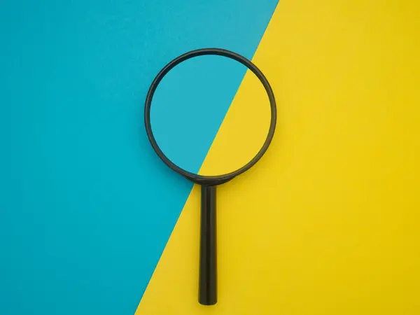 Top View Magnifying Glass Isolated Blue Yellow Background Search Concept — Stock Photo, Image