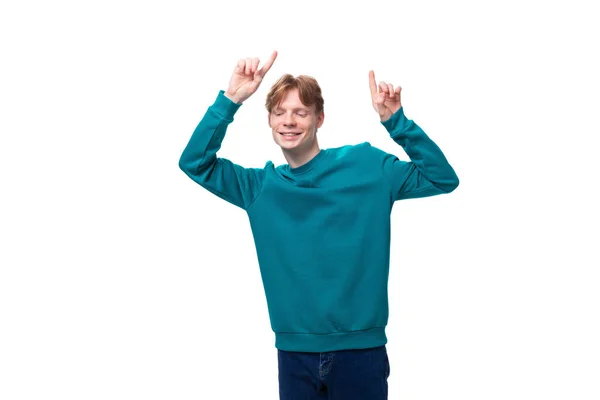 Handsome Red Haired Young Man Blue Sweater Points His Hands — Stock Photo, Image