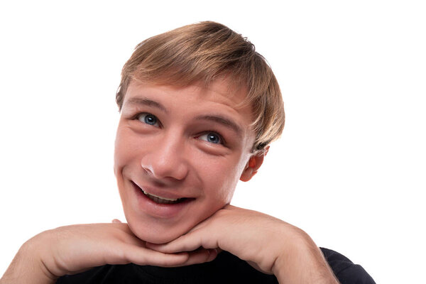 Smiling young man with blond hair on a white background.