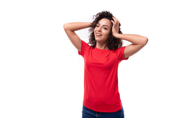 young beautiful leader woman with black curly hair dressed in a red t-shirt with mockup.