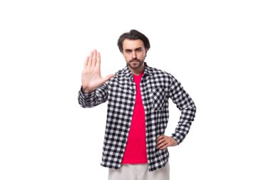 young bearded brunette man in shirt showing stop gesture.