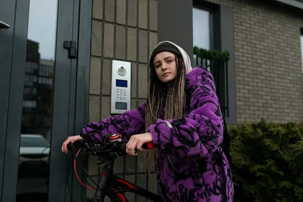 stock image Bicycle rental concept. Young woman riding a sports bike around the city.