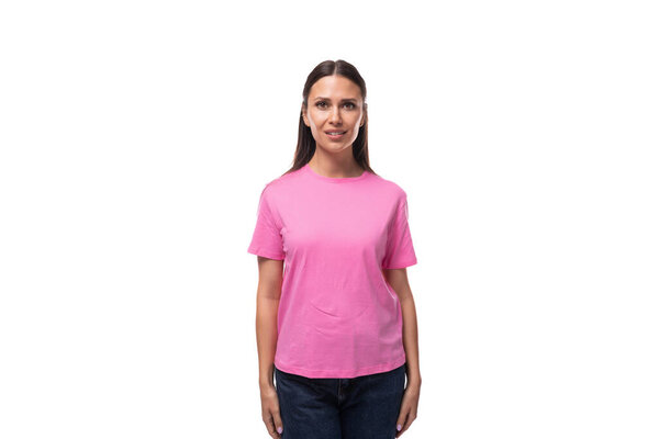 young stylish woman with straight black hair is wearing a pink t-shirt with mockup.