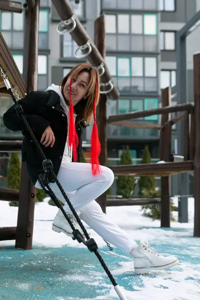 stock image Lifestyle concept, Caucasian woman walking on the playground in the cold.