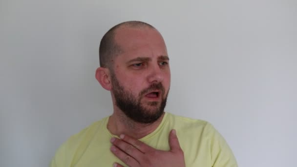 Man Yellow Shirt Suddenly Grasps His Chest Pain Displaying Signs — Stock Video