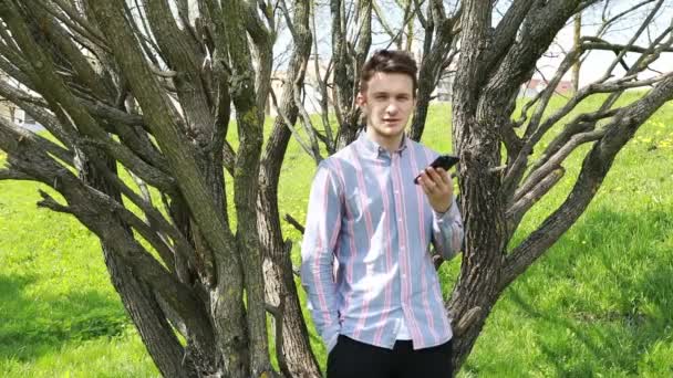Young Man Casual Buttoned Shirt Stands Amidst Grove Leafless Trees — Stock videók