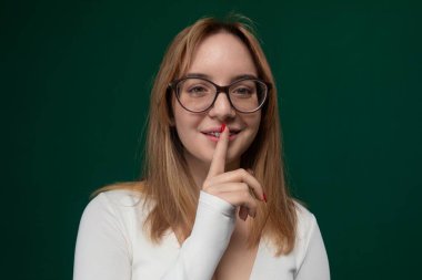 A woman wearing glasses is standing confidently in front of the camera, striking a pose for a photograph. She is smiling and exuding self-assurance as she poses for the picture. clipart