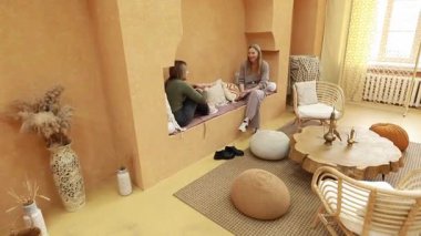 Şık, sıcak bir iç mekanda, iki arkadaş pencere pervazında ve yerde otururken kahkaha ve sohbet ederler. Uzay doğal malzemeler ve rahatlatıcı bir atmosfere sahiptir..