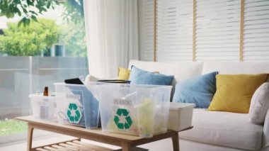 Plastic paper glass can e-waste bag water bottle in reuse bin recycle bank help climate change social issue. Trash sorting clean eco friendly go green net zero waste at home on world care earth day.