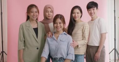 Group of young people Gen Z talent workforce relax smile look at camera standing studio shot shooting. Power of diverse asia girl woman, youth LGBT pride gay lesbian, female lady unity in women's day.